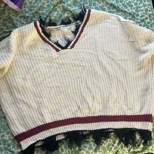 It’s a dressy crop top sweater, knitted material 100% cotton